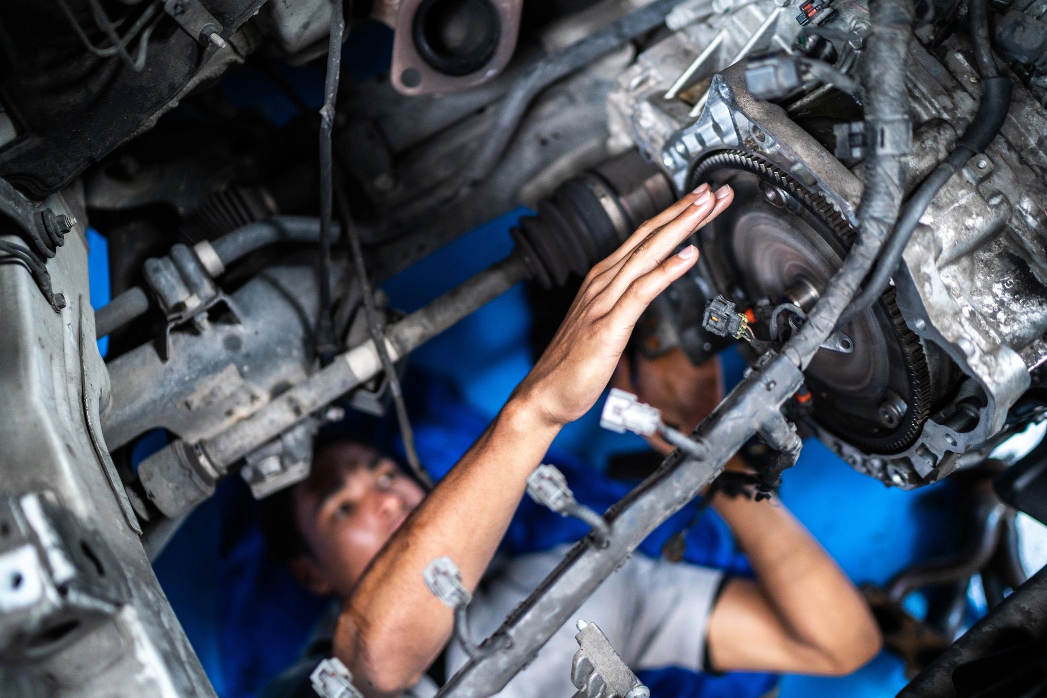 Close-up of a mechanic performing automotive repair work